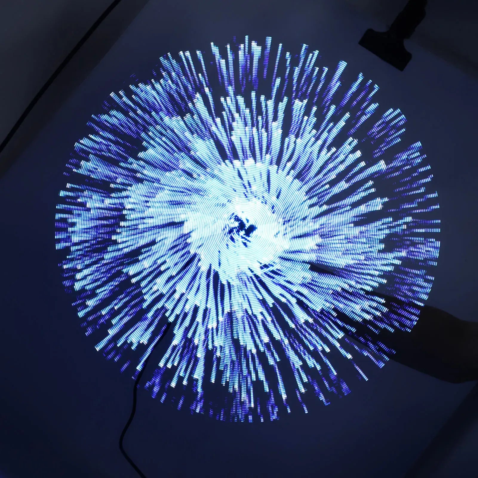 Blue LED light display on a dark background