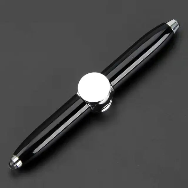 Black pen with a silver clip on a dark background