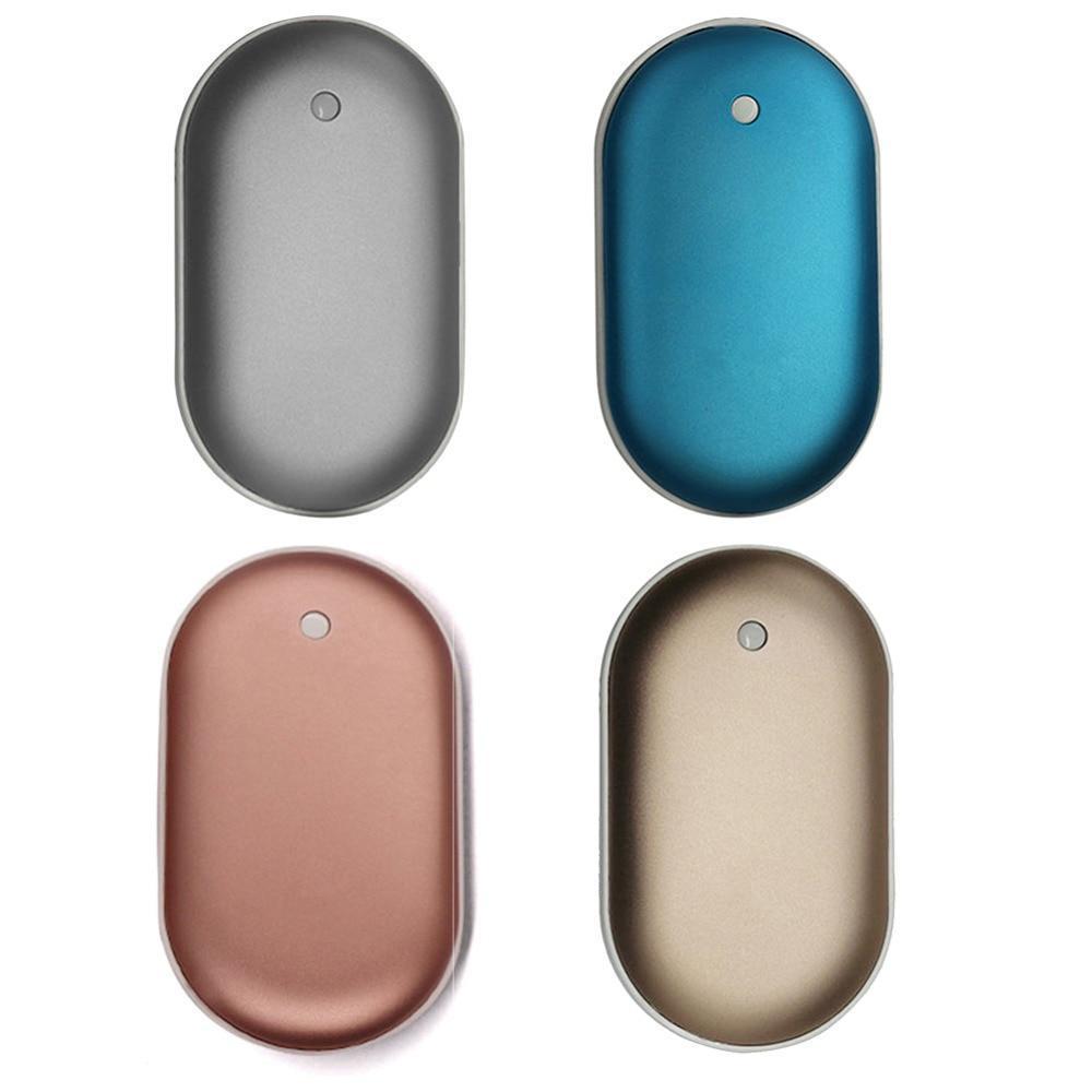 Four oval-shaped metal objects in different colors on a white background