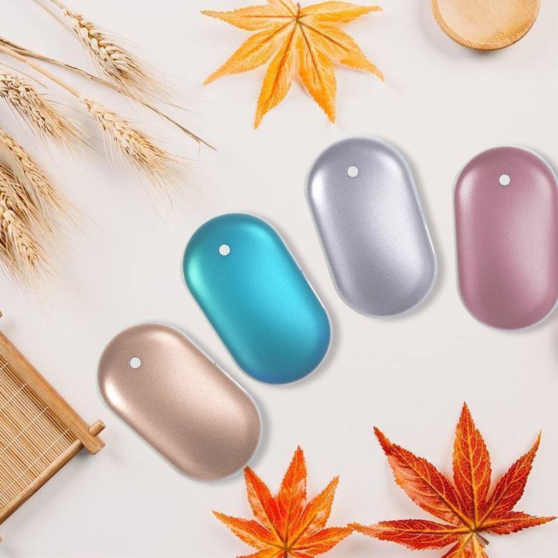 Four oval-shaped devices in gold, blue, silver, and pink on a light background with autumn leaves and wheat.