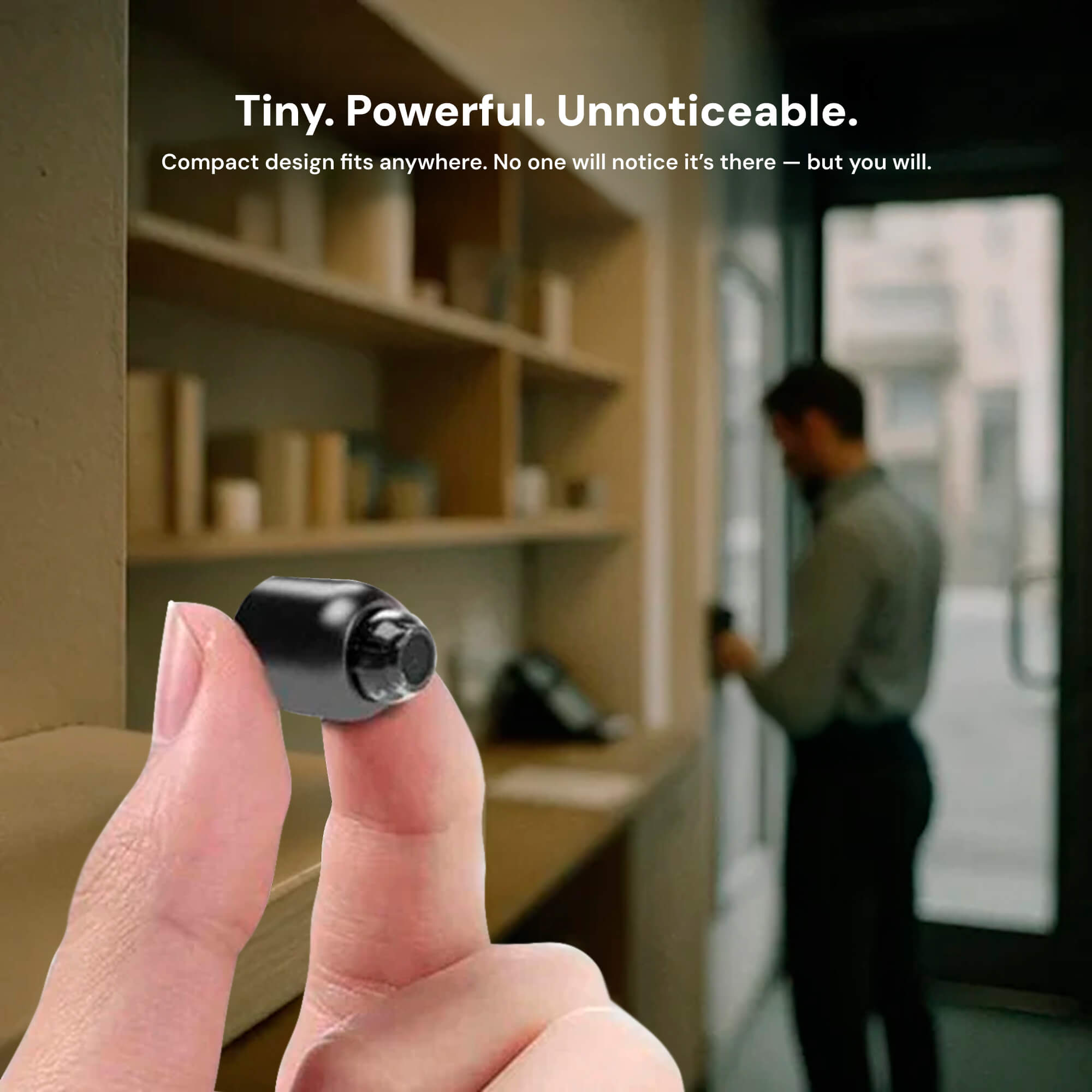 Small black device held between fingers with a blurred office background and text about its compact design.