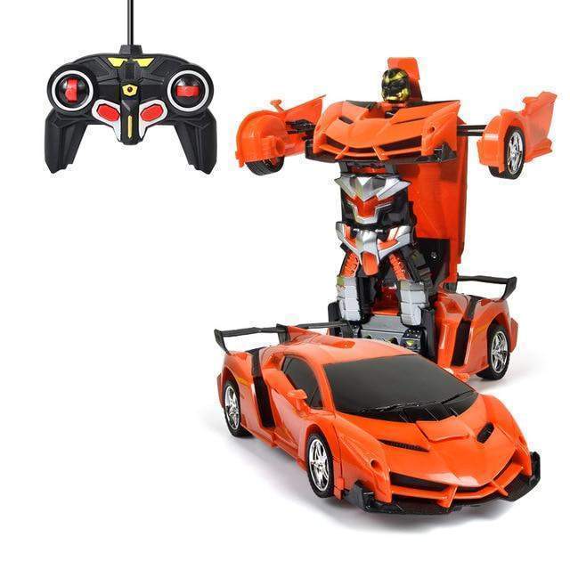 Orange toy car with robot transformation feature and remote control on a white background