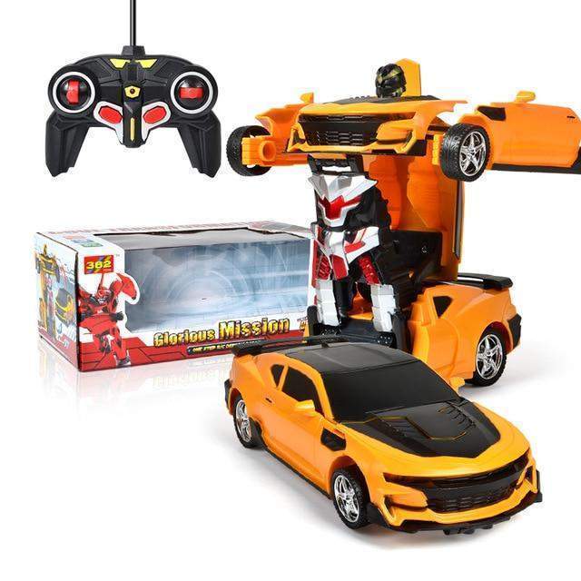 Transforming toy car with remote control and robot figure, next to packaging box.