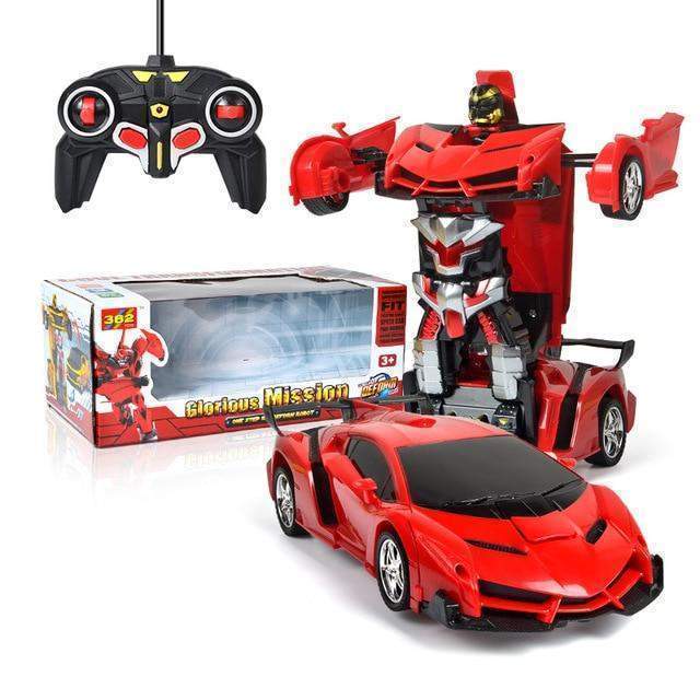 Red toy car transforming into a robot with remote control and packaging on a white background