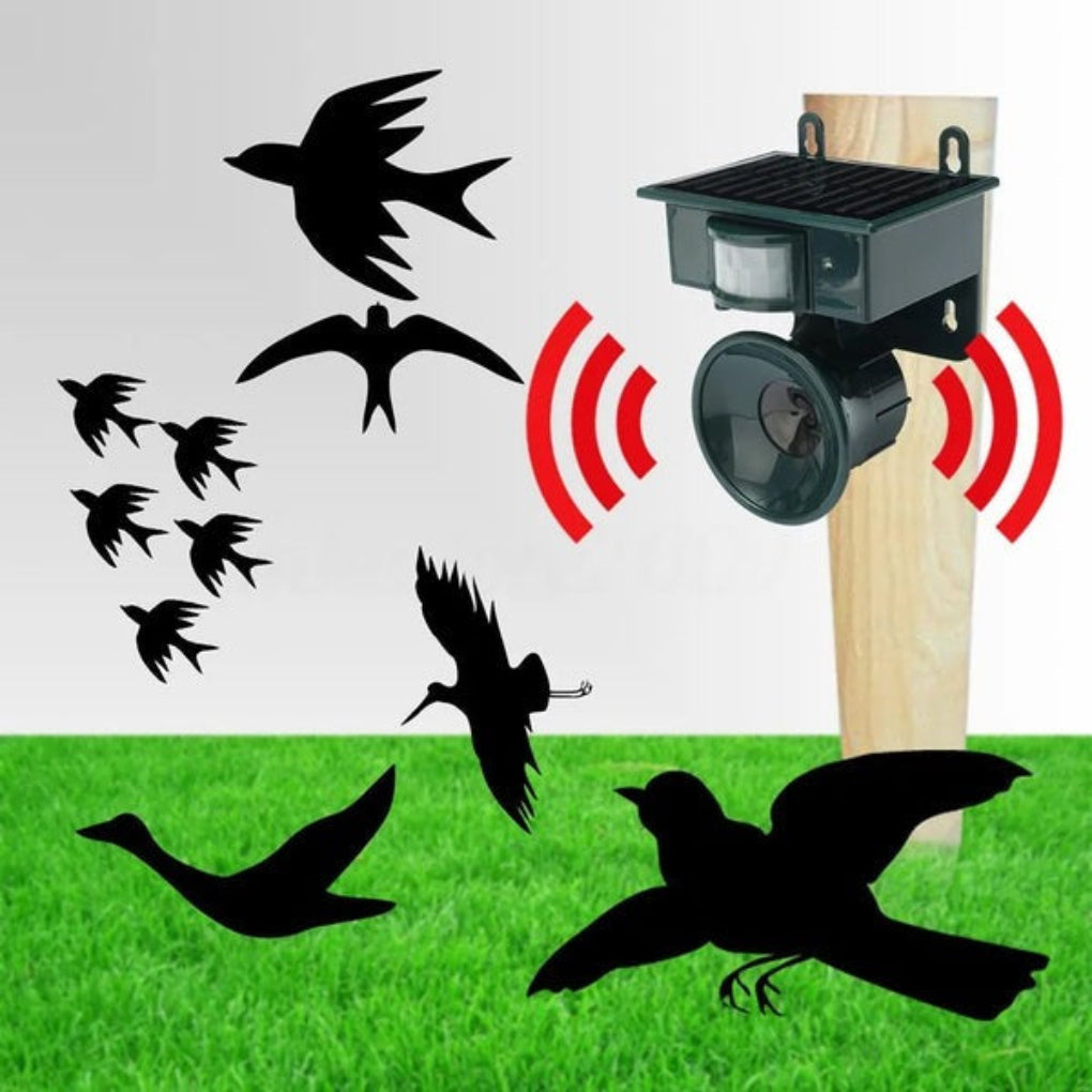 Bird repeller device with black birds silhouettes on a grassy background
