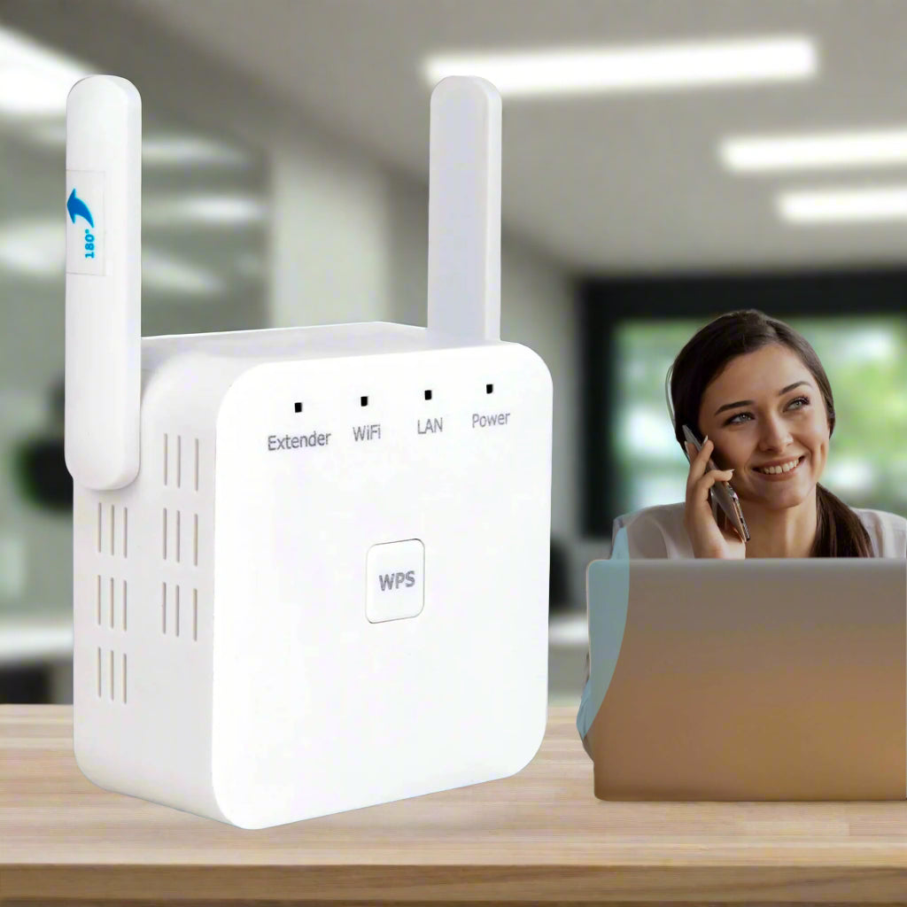 White Wi-Fi range extender on a desk with a blurred background of a woman using a laptop.