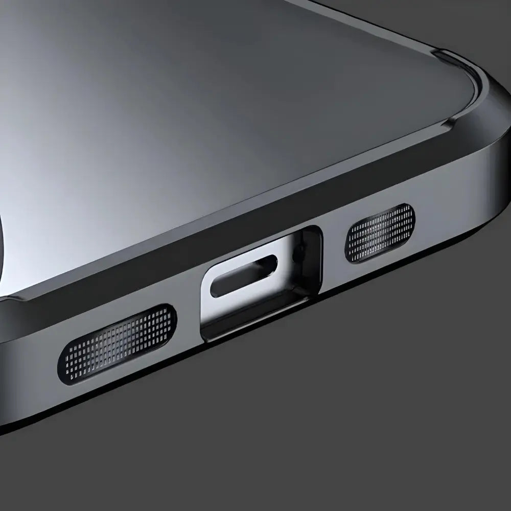 Close-up of a phone case with charging port and speaker grilles on a dark background