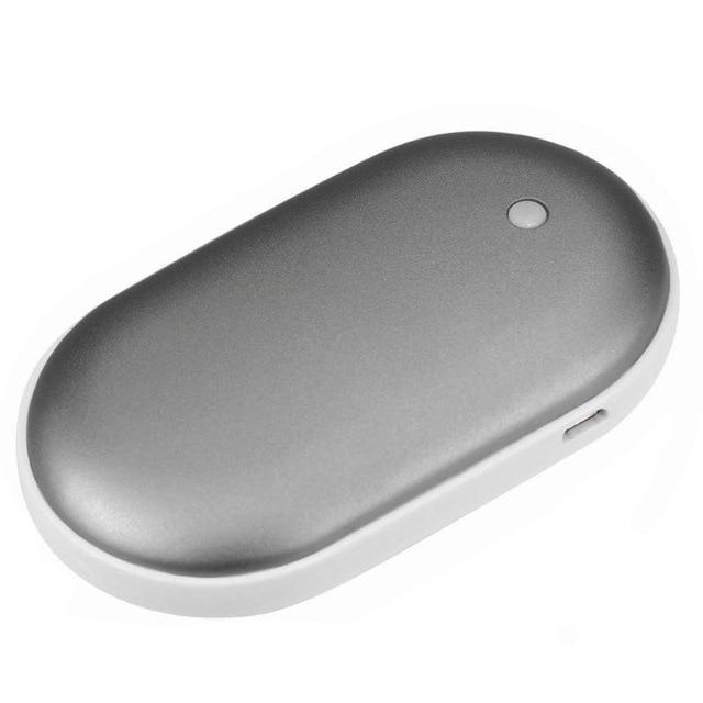 Silver oval-shaped portable device on a white background